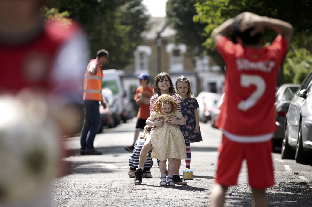 Children hopscotching in the street